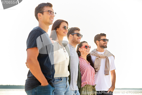 Image of happy friends on summer beach