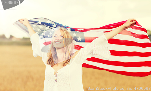 Image of happy woman with american flag on cereal field