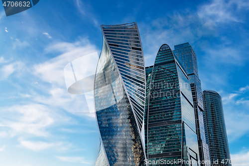 Image of Skyscraper and cloudy blue sky background