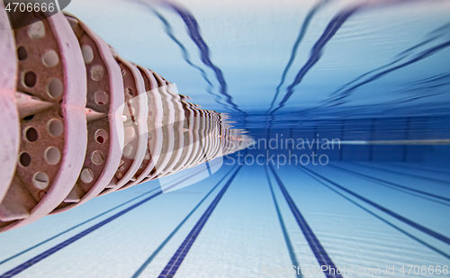 Image of Olympic Swimming pool under water background.