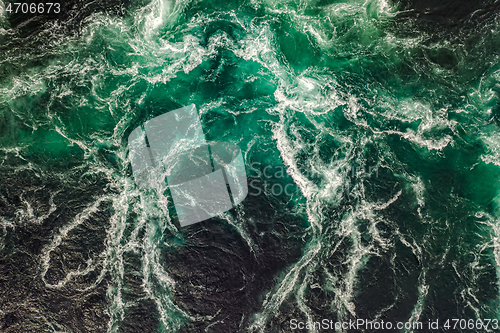 Image of Waves of water of the river and the sea meet each