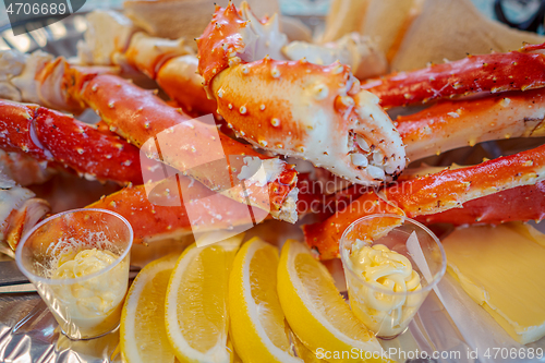 Image of Red king crab legs with fresh lemon slices