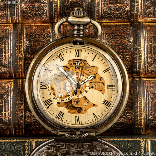 Image of Antique clock dial close-up. Vintage pocket watch.