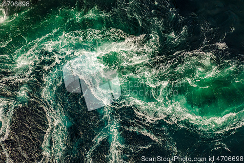 Image of Waves of water of the river and the sea meet each