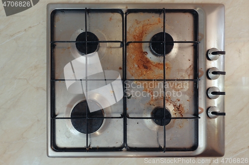 Image of Dirty stove in a kitchen