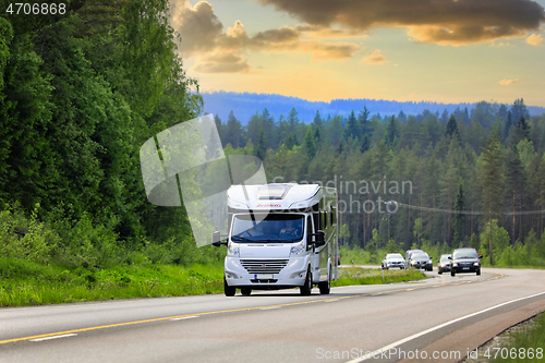 Image of Dethleffs Esprit Motorhome on Road at Dusk