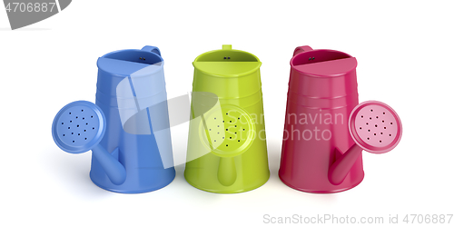 Image of Three colorful watering cans