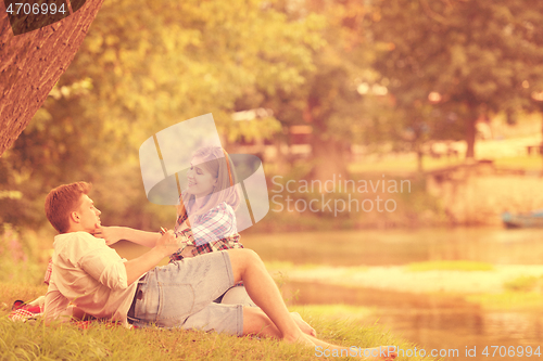 Image of Couple in love enjoying picnic time