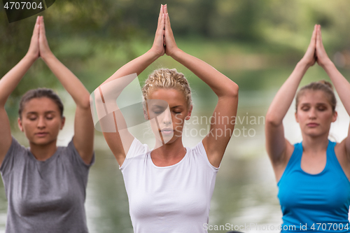 Image of women meditating and doing yoga exercise