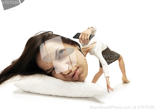 Image of Big head on small body lying on the pillow