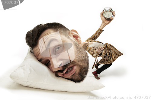 Image of Big head on small body lying on the pillow