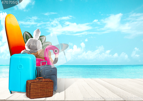 Image of Collage of luggage for travel in front of ocean view
