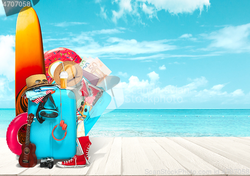 Image of Collage of luggage for travel in front of ocean view