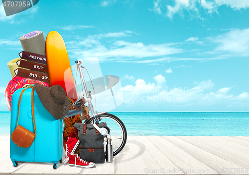 Image of Collage of luggage for travel in front of ocean view