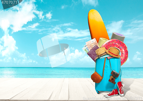 Image of Collage of luggage for travel in front of ocean view