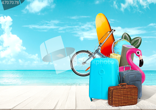 Image of Collage of luggage for travel in front of ocean view