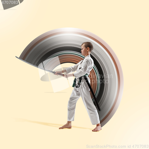 Image of Teen boy fighting at aikido training in martial arts school