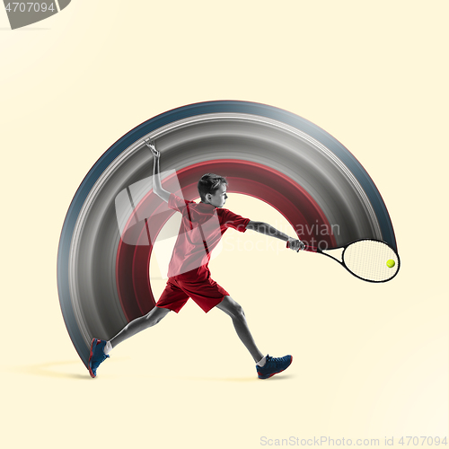 Image of Young tennis player isolated on yellow background