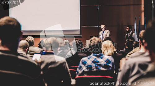 Image of Business speaker giving a talk at business conference meeting event.