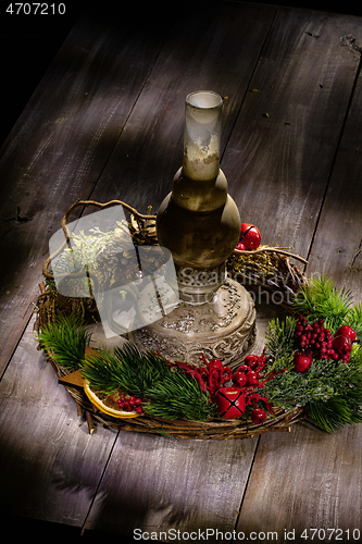 Image of Old Oil Lamp And Christmas Garland