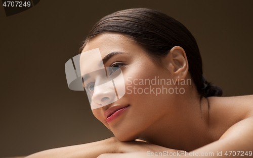 Image of young woman lying at spa or massage parlor