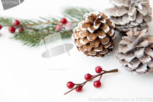 Image of christmas balls and fir branches with pine cones