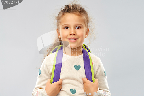 Image of happy little girl with school backpack