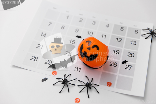 Image of halloween party decorations and calendar