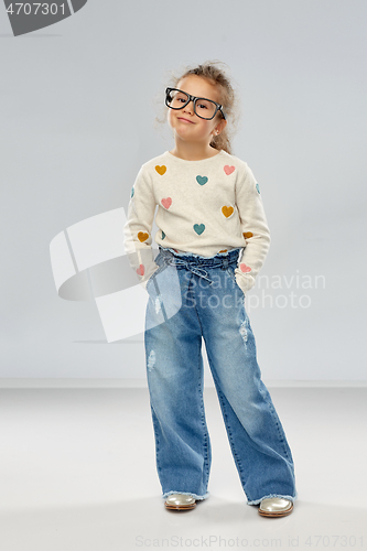 Image of smiling little girl in glasses