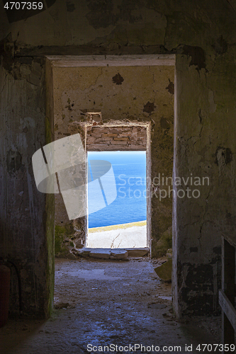 Image of View through old abandoned dilapidated building on the blue seas
