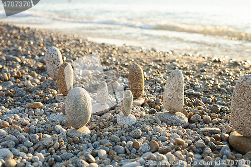 Image of Beautiful seascape, amazing view of pebble coastline in mild sun