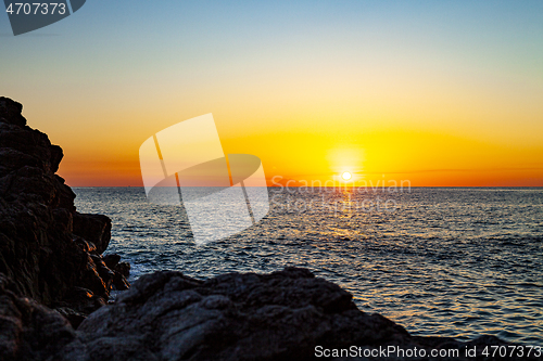 Image of Red sunset over the sea. Beautiful sunset. 