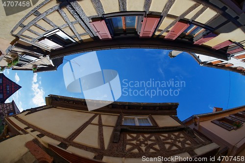 Image of Fisheye view of the sky above a narrow street in Riquewihr town, Alsace, France