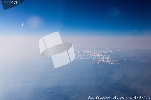 Image of Mountain view from an airplane window.