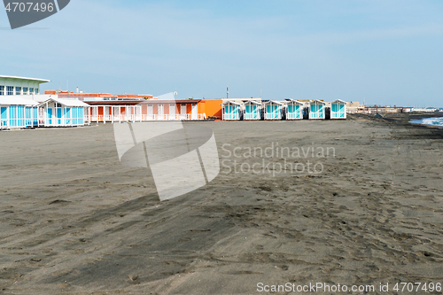 Image of Beautiful sea and the black sandy beach with beach houses