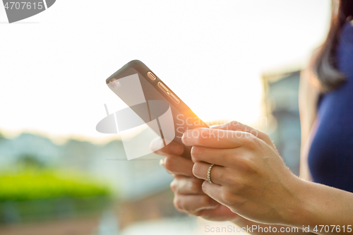 Image of Woman touch on cellphone