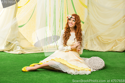 Image of beautiful girl in yellow dress
