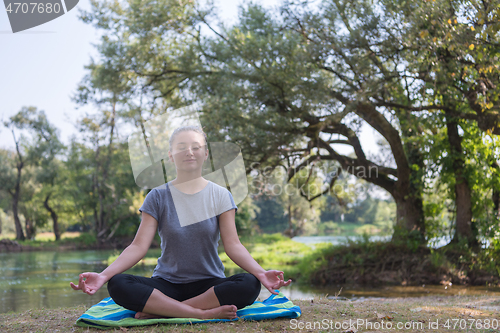 Image of woman meditating and doing yoga exercise