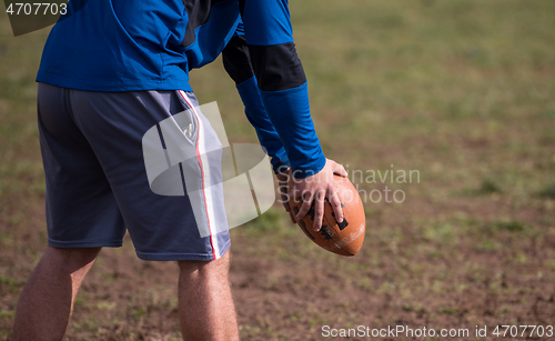 Image of american football kicker practicing kickoff