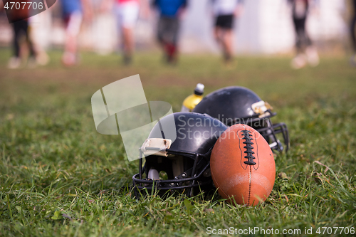 Image of American football helmets and ball