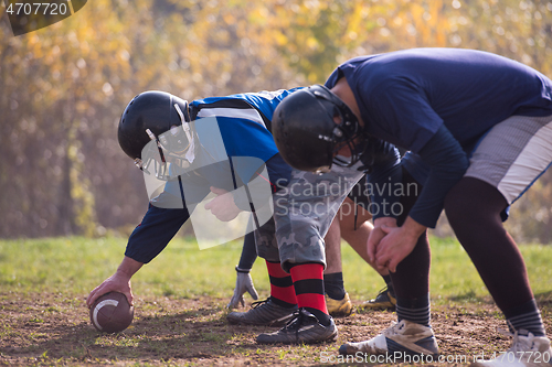 Image of american football team in action