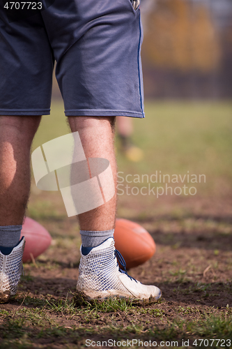 Image of american football kicker practicing kickoff