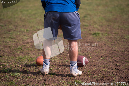 Image of american football kicker practicing kickoff