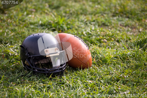 Image of American football helmet and ball