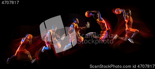 Image of Young basketball player against dark background