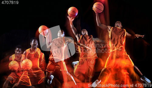 Image of Young basketball player against dark background