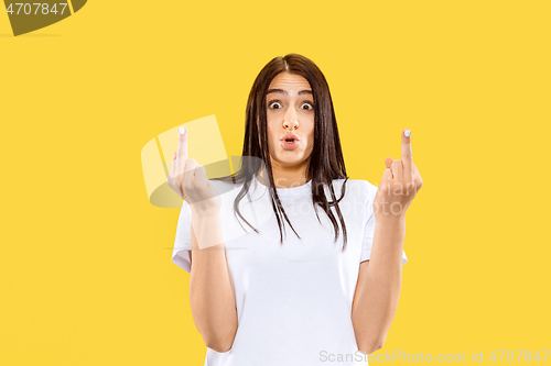 Image of Portrait of beautiful woman isolated on yellow studio background
