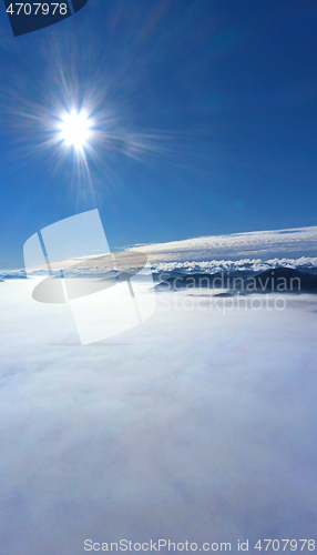 Image of Morning sun over low clouds