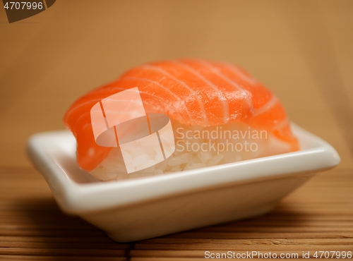 Image of sushi with salmon on a small plate