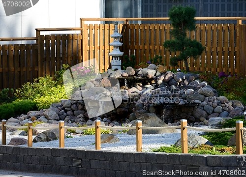 Image of a traditional Japanese garden at the entrance to a supermarket c